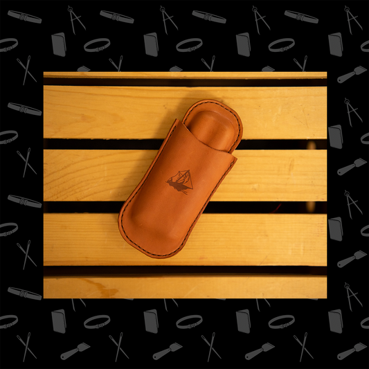 Leather cigar case with a logo on a wooden surface