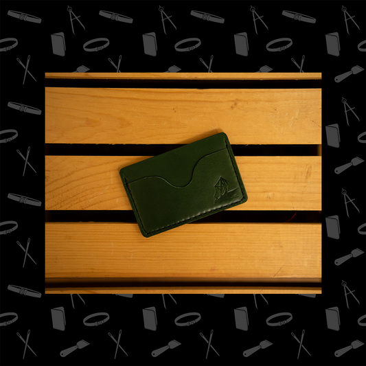 Green horizontal leather wallet with three pockets.