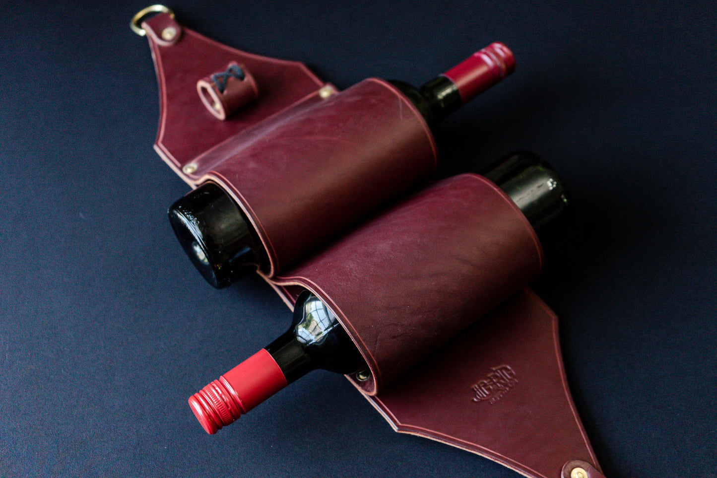 Burgundy leather wine rack with bottles