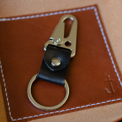 Leather key chain in a leather valet snap tray